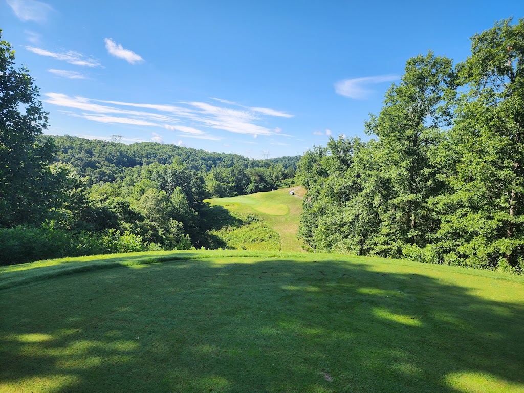 Panoramic view of a lush green golf course at Yatesville Lake Golf Course (Eagle Ridge). Smooth