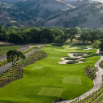 Panoramic view of a lush green golf course at Yocha Dehe Golf Club. Smooth