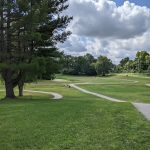 Panoramic view of a lush green golf course at Zionsville Golf Course. Smooth