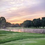 Panoramic view of a lush green golf course at Zoar Village Golf Course. Smooth