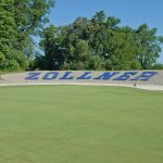 Panoramic view of a lush green golf course at Zollner Golf Course. Smooth