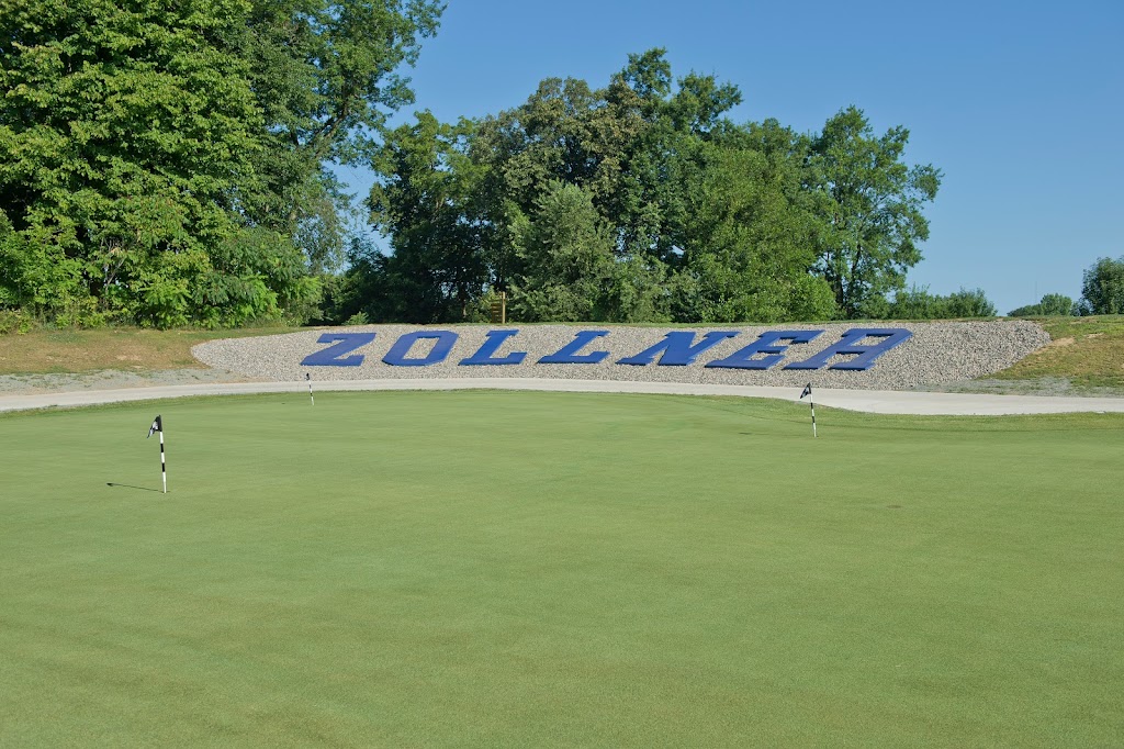 Panoramic view of a lush green golf course at Zollner Golf Course. Smooth